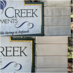 Concrete cleaning of a sign performed by Oddly Satisfying Pressure Washing