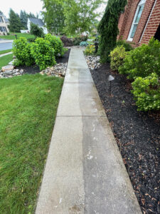 Long concrete walkway pressure washed by Oddly Satisfying Pressure Washing