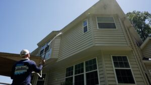 Oddly Satisfying Pressure Washing employee pressure washing the outside of a house