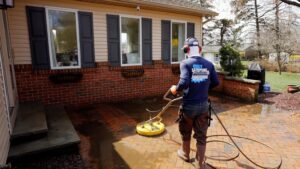 Oddly Satisfying Pressure Washing employee cleaning a patio