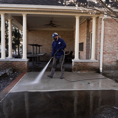 Oddly Satisfying Pressure Washing employee pressure washing concrete